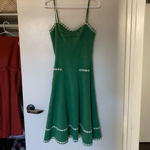 Green dress with daisies on trim